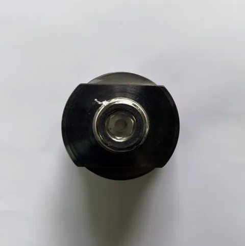 Lower end of Parker Finite S1R-6C04-023 showing clean machined surfaces and drain plug
