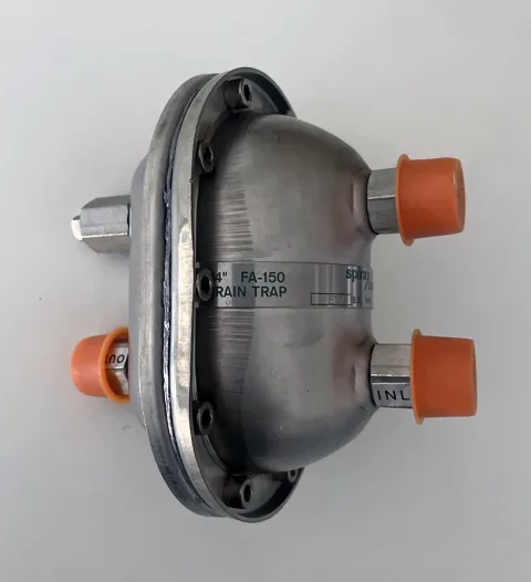 Opposite side of the Spirax Sarco drain trap with body identification and retained port caps
